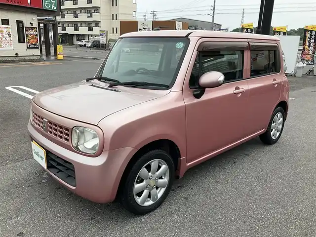 スズキ ラパン X 滋賀県 2009(平21)年 7.8万km チェリーピンクパールメタリック ・車検8年3月まで/・社外7インチナビ/CD、ワンセグテレビ/・純正フロアマット/・光軸調整ダイヤル/・ウィンカーミラー/・ドアバイザー/・プッシュスタート/・アクセサリーソケット/・スペアキー有り/・取扱説明書/・保証書