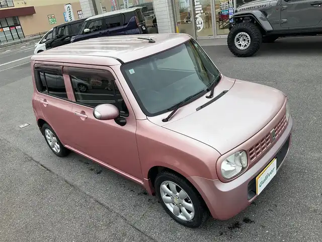 スズキ ラパン X 滋賀県 2009(平21)年 7.8万km チェリーピンクパールメタリック ・車検8年3月まで/・社外7インチナビ/CD、ワンセグテレビ/・純正フロアマット/・光軸調整ダイヤル/・ウィンカーミラー/・ドアバイザー/・プッシュスタート/・アクセサリーソケット/・スペアキー有り/・取扱説明書/・保証書