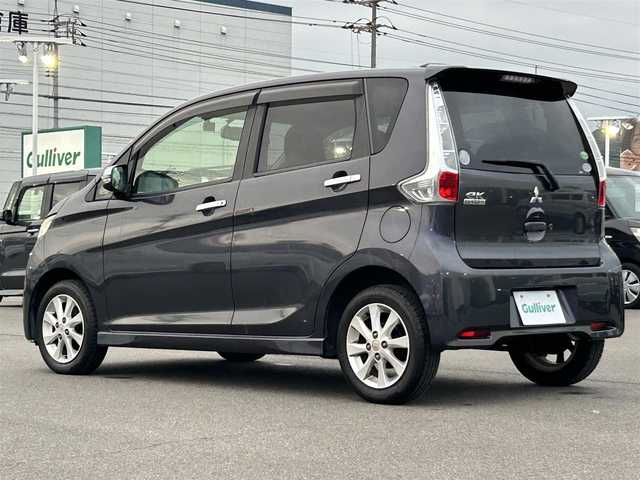 三菱 ｅＫカスタム G 岡山県 2013(平25)年 6.8万km パープリッシュネイビーパール 登録時走行距離67689km/純正ナビ/フルセグTV(AM/FM/CD/Bluetooth)/バックカメラ/前後ドライブレコーダー/ETC/アイドリングストップ/電動格納ミラー/純正フロアマット/14インチ純正AW/プッシュスタート/スマートキー(スペア×1)