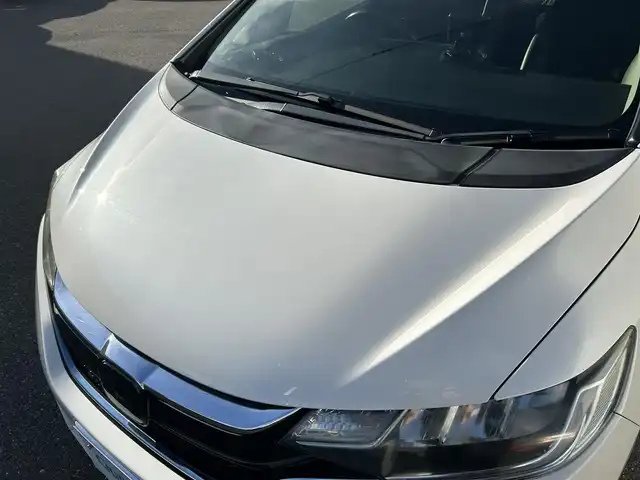 ホンダ フィット ハイブリット L ホンダセンシング 山形県 2018(平30)年 8.7万km プレミアムホワイトパールⅡ 禁煙車/純正SDナビ/・TV/AM/FM/CD/DVD/アダプティブクルーズコントロール/アイドリングストップ/レーンキープアシスト/衝突被害軽減ブレーキ/標識認識機能/車線逸脱警報/先行車発進お知らせ/横滑り防止装置/LEDヘッドライト/オートライト/フロントフォグランプ/ハーフレザーシート/バックカメラ/純正フロアマット/純正ドアバイザー/ETC/冬タイヤ積み込み/保証書/取扱説明書