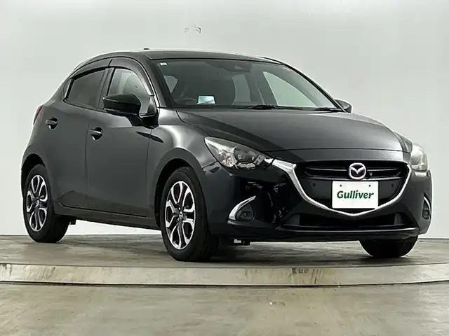 マツダ デミオ XD ツーリング 愛知県 2019(令1)年 7.6万km ジェットブラックマイカ 禁煙車/ディーゼル/ターボ/純正7インチナビ/(CD/DVD/Bluetooth/フルセグTV)/全方位カメラ/i-ACTIVESENSE/・衝突軽減ブレーキ/・レーンキープアシスト/・ブラインドスポットモニター/・オートハイビーム/・リアクロストラフィックアラート/ヘッドアップディスプレイ/クルーズコントロール/ETC/シートヒーター/パドルシフト/純正16インチアルミホイール/スマートキー/スペアキー1本/プッシュスタート/LEDヘッドライト/フロントフォグランプ/横滑り防止機能/オートエアコン