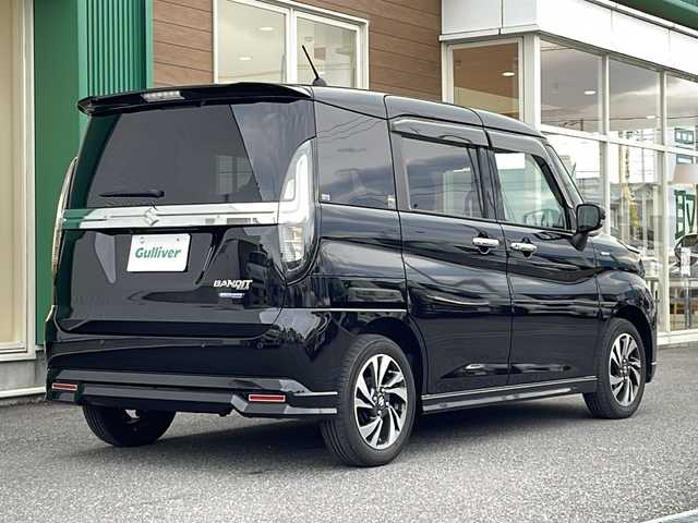 スズキ ソリオ バンディット HV MV 岐阜県 2023(令5)年 3.4万km スーパーブラックパール 禁煙車/社外フルセグナビ/クルーズコントロール/衝突軽減ブレーキ/レーンキープアシスト/クリアランスソナー/片側スライドドア/後方コーナーセンサー/ヘッドアップディスプレイ/アイドリングストップ/ETC/カーテンエアバッグ/LEDヘッドライト/オートエアコン/オートライト/オートハイビーム/ドアバイザー/純正フロアマット/純正アルミホイール/プッシュスタート/盗難防止/フォグライト/スマートキー