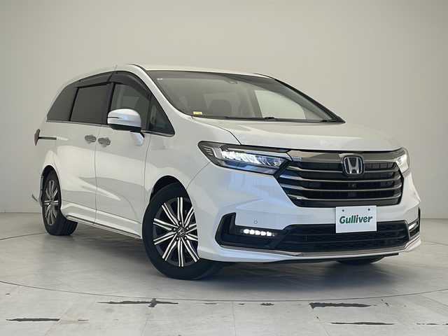 ホンダ オデッセイ ハイブリッド e:HEVアブソルート 沖縄県 2021(令3)年 4.5万km プラチナホワイトパール 純正ＯＰナビ　/(フルセグＴＶ　ＤＶＤ再生　ＢＴ接続)/アラウンドビューモニター　/前後ドライブレコーダー　/ＨＤＭＩ　/両側パワースライドドア　/ハーフレザーシート　/オットマン　/ＬＥＤオートライト　/ドアバイザー
