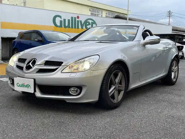 メルセデス・ベンツ ＳＬＫ２００ コンプレッサー 静岡県 2010(平22)年 2.6万km イリジウムシルバー 電動オープン/社外ナビ/フルセグTV/DVD/CD/BT/SD/MSV/黒革シート/前席シートヒーター/前席パワーシート/クルーズコントロール/HIDヘッドライト/ETC/ステアリングスイッチ/キーレス×2/純正16インチAW/保証書/取扱説明書/H25/27/R1/3/4/5点検記録簿有