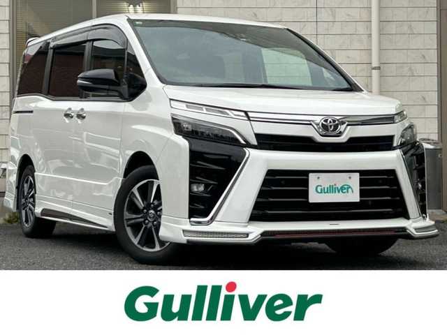 トヨタ ヴォクシー ZS 煌Ⅲ 福岡県 2020(令2)年 1.9万km ホワイトパールクリスタルシャイン アルパインスタイル/・フロントハーフスポイラー/・サイドステップスポイラー/・リアハーフスポイラー/・リアハーフ純正マフラー用フィン/・コーナーダクト/アルパイン11インチナビ【EX11NX】/(AM/FM/CD/DVD/Bluetooth/iPod/HDMI/フルセグTV)/バックカメラ/トヨタセーフティセンス/・プリクラッシュセーフティ/・レーンディパーチャーアラート/・オートマッチックハイビーム/・先行車発進告知機能/クルーズコントロール/クリアランスソナー/盗難防止装置/両側パワースライドドア/純正16インチアルミホイール/アルパインナビ連動型前後ドライブレコーダー【DVR-C320R】/ビルトインETC/黒色ハーフレザーシート/社外フロアマット/社外黒色ミラーカバー/純正ミラーカバー(積載)/後席ロールサンシェード/助手席シートバックテーブル/電格ウインカーミラー/ISOFIX/スペアキー×1/保証書/取扱説明書/ナビ取扱説明書