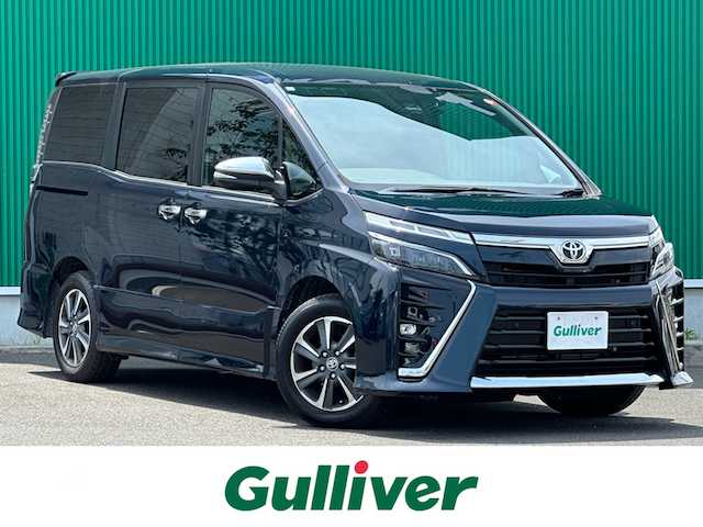 トヨタ ヴォクシー ZS 煌Ⅲ 宮城県 2020(令2)年 6.4万km ブラッキッシュアゲハガラスフレーク ワンオーナー/セーフティセンス/・プリクラッシュセーフティ/・レーンディパーチャーアラート/・オートマチックハイビーム/・先行車発進告知/クリアランスソナー/パーキングサポートブレーキ/純正10インチナビ（NSZN-Z68T）/・CD/DVD/・Bluetooth/・フルセグTVTVキャンセラー有/バックカメラ/ビルトインETC/ドライブレコーダー/両側パワースライドドア/ハーフレザーシート/革巻きステアリング/クルーズコントロール/ステアリングスイッチ/LEDヘッドランプ/フォグランプ/オートライト/スマートキー＆プッシュスタート/スペアキー/電動格納ミラー/純正16インチAW/純正フロアマット/W/サイド/カーテンエアバッグ/取扱説明書/保証書