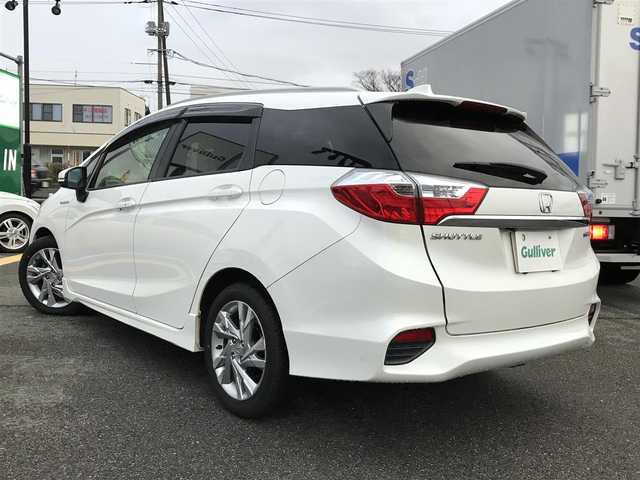 ホンダ シャトル ハイブリッド Z ホンダセンシング 鳥取県 2018(平30)年 8.9万km ホワイトオーキッドパール 純正ナビ/フルセグ/CD/DVD/BT/バックカメラ・ETC/ホンダセンシング/レーンキープアシスト/レーダークルーズコントロール/ハーフレザーシート/ドライブレコーダー/LEDヘットライト/フォグライト/純正16インチアルミホイール/パドルシフト/プッシュエンジンスタート/スペアキー/純正フロアマット/ドアバイザー/保証書・取扱説明書
