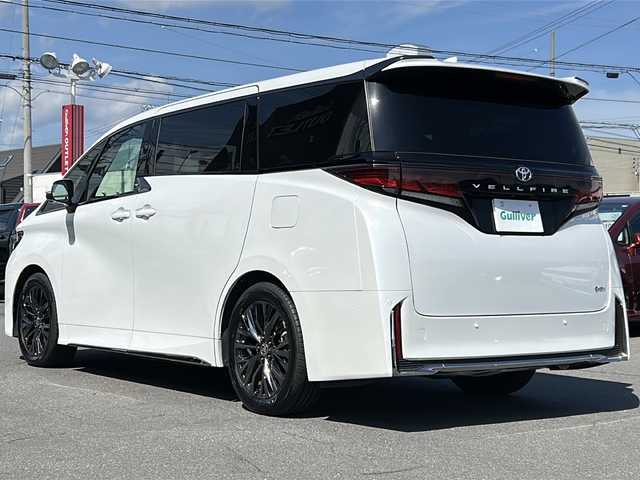 トヨタ ヴェルファイア ハイブリット Z プレミア 長野県 2024(令6)年 0.9万km プラチナホワイトパールマイカ ・純正12.3インチメモリーナビゲーション/AM FM Bluetooth/・全方位カメラ/・ビルトインETC2.0/・ムーンルーフ/・プリクラッシュセーフティ/・レーダークルーズコントロール/・レーンキープアシスト/・ブラインドスポットモニター/・オートマチックハイビーム/・ユニバーサルステップ/・トヨタチームメイト/・ヘッドアップディスプレイ/・フリップダウンモニター/・パワーバックドア/・両側パワースライドドア/・純正19インチアルミホイール/・置くだけ充電/・LEDヘッドライト/・オートライト/・フォグライト/・シートヒーター(D/N)/・エアーシート(D/N)/・パドルシフト/・ステアリングヒーター/・ステアリングリモコン/・コーナーセンサー/・デジタルインナーミラー/・ウィンカーミラー/・電動格納ミラー/・スマートキー/・エンジンプッシュスタート