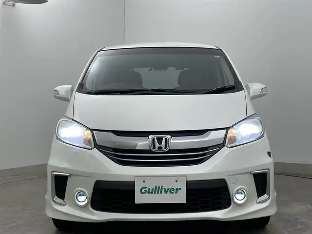 ホンダ フリード ハイブリット プレミアムエディション 岡山県 2016(平28)年 6.8万km ホワイトオーキッドパール 純正メモリナビゲーション/(CD/DVD/SD/BT/USB/ワンセグTV)/バックカメラ/ビルトインETC/社外ドライブレコーダー前後/ハーフレザーシート/両側パワースライドドア/スマートキー×2/ステアリングリモコン/チルトステアリング/クルーズコントロール/シートリフター/HIDヘッドライト/フォグランプ/横滑り防止/ISOFIX/純正フロアマット/純正リアスポイラー/保証書/取扱説明書