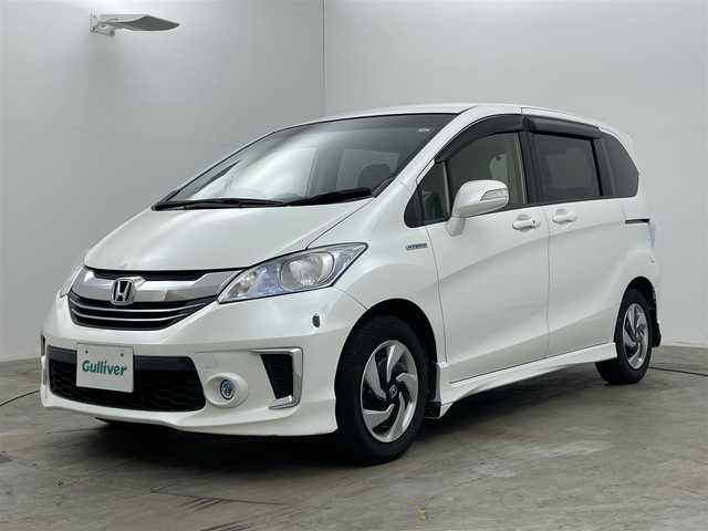 ホンダ フリード ハイブリット プレミアムエディション 岡山県 2016(平28)年 6.8万km ホワイトオーキッドパール 純正メモリナビゲーション/(CD/DVD/SD/BT/USB/ワンセグTV)/バックカメラ/ビルトインETC/社外ドライブレコーダー前後/ハーフレザーシート/両側パワースライドドア/スマートキー×2/ステアリングリモコン/チルトステアリング/クルーズコントロール/シートリフター/HIDヘッドライト/フォグランプ/横滑り防止/ISOFIX/純正フロアマット/純正リアスポイラー/保証書/取扱説明書