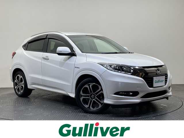 ホンダ ヴェゼル ハイブリッド Z ホンダセンシング 愛媛県 2018(平30)年 14万km ホワイトオーキッドパール 純正ナビ/ワンセグ／Ｂｌｕｅｔｏｏｔｈ／ＵＳＢ/バックカメラ/衝突被害軽減ブレーキ/クルーズコントロール/ＥＴＣ/ＤＮ席シートヒーター/ＬＥＤヘッドライト/ハーフレザーシート/チップアップシート/スペアキー