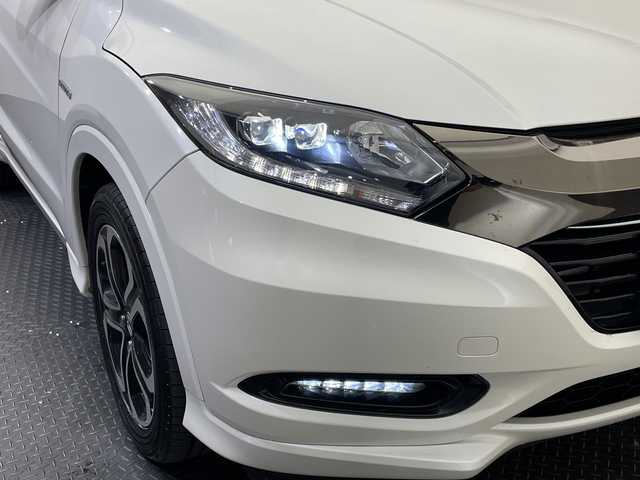 ホンダ ヴェゼル ハイブリッド Z ホンダセンシング 愛媛県 2018(平30)年 14万km ホワイトオーキッドパール 純正ナビ/ワンセグ／Ｂｌｕｅｔｏｏｔｈ／ＵＳＢ/バックカメラ/衝突被害軽減ブレーキ/クルーズコントロール/ＥＴＣ/ＤＮ席シートヒーター/ＬＥＤヘッドライト/ハーフレザーシート/チップアップシート/スペアキー