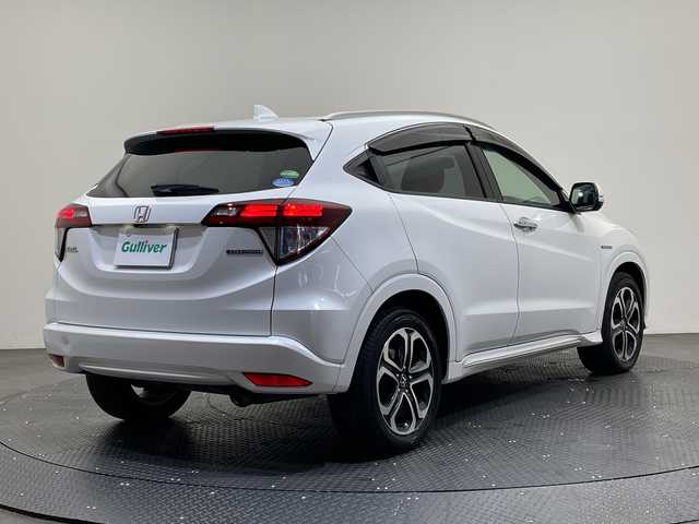 ホンダ ヴェゼル ハイブリッド Z ホンダセンシング 愛媛県 2018(平30)年 14万km ホワイトオーキッドパール 純正ナビ/ワンセグ／Ｂｌｕｅｔｏｏｔｈ／ＵＳＢ/バックカメラ/衝突被害軽減ブレーキ/クルーズコントロール/ＥＴＣ/ＤＮ席シートヒーター/ＬＥＤヘッドライト/ハーフレザーシート/チップアップシート/スペアキー