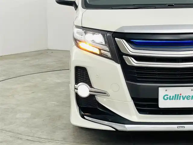 トヨタ アルファード SA 福島県 2015(平27)年 6.3万km ラグジュアリーホワイトパールクリスタルシャインガラスフレーク ４WD/モデリスタエアロ/純正ナビ/・フルセグ/CD/SD/FM/AM/BT/・バックカメラ/・ビルトインETC/純正フリップダウンモニター/両側パワースライドドア/社外前後ドライブレコーダー/革巻きステアリング/・ステアリングスイッチ/・クルーズコントロール/LEDヘッドライト/・フォグランプ/・オートライト/電動パーキングブレーキ/・ブレーキホールド/純正フロアマット/ドアバイザー/スマートキー/・プッシュスタート