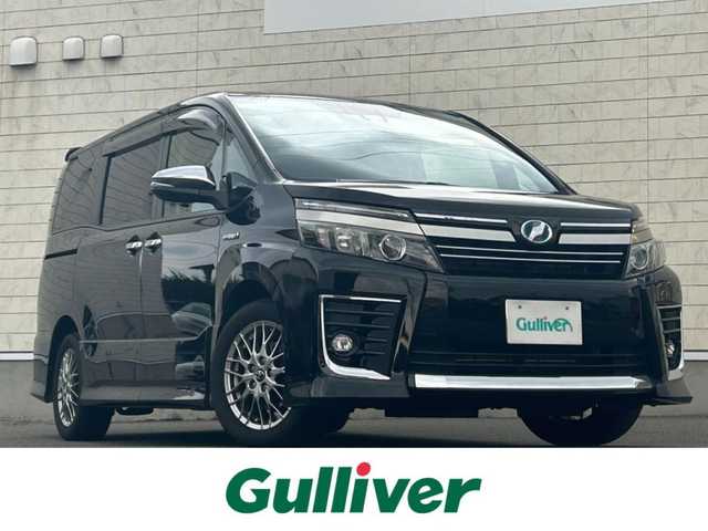 トヨタ ヴォクシー ハイブリッド ZS 煌Ⅱ 山形県 2016(平28)年 10.8万km ブラック 純正10インチナビ/FM/AM/フルセグ/Bluetooth/衝突軽減ブレーキ/車線逸脱防止/両側パワースライドア/純正バイザー/純正マット/LEDライト/フォグランプ/スペアキー/スマートキー/アルミ付きスタッドレスタイヤ積載