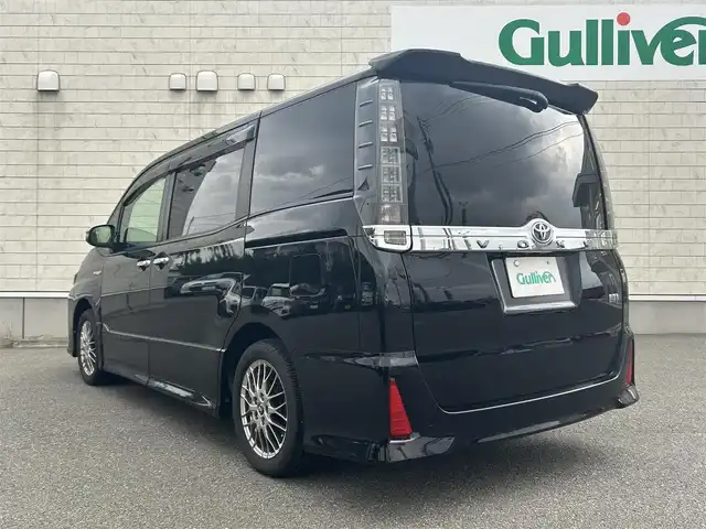 トヨタ ヴォクシー ハイブリッド ZS 煌Ⅱ 山形県 2016(平28)年 10.8万km ブラック 純正10インチナビ/FM/AM/フルセグ/Bluetooth/衝突軽減ブレーキ/車線逸脱防止/両側パワースライドア/純正バイザー/純正マット/LEDライト/フォグランプ/スペアキー/スマートキー/アルミ付きスタッドレスタイヤ積載