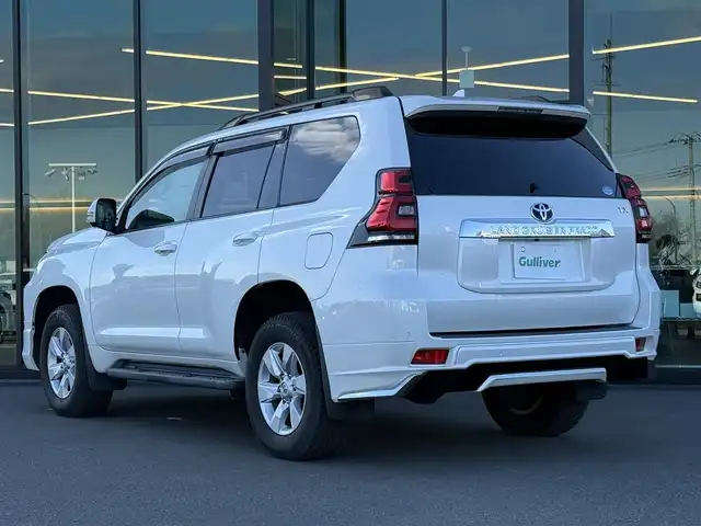 トヨタ ランドクルーザー プラド TX Lパッケージ 東京都 2019(平31)年 1.5万km ホワイトパールクリスタルシャイン セーフティセンス/プリクラッシュセーフティ/レーントレーシングアシスト/オートハイビーム/ブラインドスポットモニター/レーダークルーズ/純正メーカーナビ/CD/DVD/BT/AM/FM/TV/バックカメラ/LEDヘッドライト/フォグ/サンルーフ/ルーフレール/モデリスタエアロ/レザーシート（ベージュ）/シートヒーター/ベンチレーション/ビルトインETC2.0