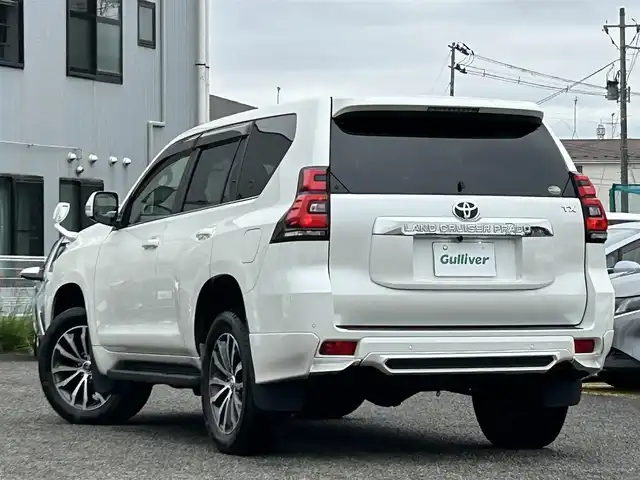 トヨタ ランドクルーザー プラド TX Lパッケージ 宮城県 2020(令2)年 6.5万km ホワイトパールクリスタルシャイン 装備/ベージュ内装/サンルーフ/ＴＲＤ前後エアロ/純正ナビ/(AM、FM、CD、DVD、フルセグTV、SD、BT、USB)/純正エンジンスターター×１/スペアキー×１/ＴＶキャンセラー/３列シート/ウッドステアリング/プッシュスタートボタン/ドアバイザー/機能/寒冷地仕様/レーダークルーズコントロール/レーンキープアシスト/シートヒーターD、N/シートクーラーD、N/パワーシートD、N/横滑り防止/2ndSTARTボタン/四駆切り替えボタン/オフロード切り替えボタン/リアフォグインジケーター/オートライト/アイドルアップ
