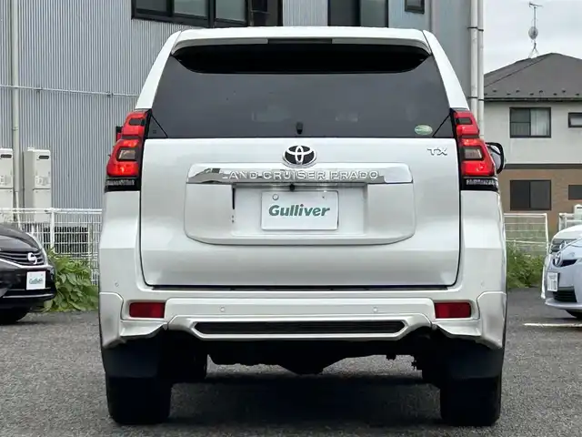 トヨタ ランドクルーザー プラド TX Lパッケージ 宮城県 2020(令2)年 6.5万km ホワイトパールクリスタルシャイン 装備/ベージュ内装/サンルーフ/ＴＲＤ前後エアロ/純正ナビ/(AM、FM、CD、DVD、フルセグTV、SD、BT、USB)/純正エンジンスターター×１/スペアキー×１/ＴＶキャンセラー/３列シート/ウッドステアリング/プッシュスタートボタン/ドアバイザー/機能/寒冷地仕様/レーダークルーズコントロール/レーンキープアシスト/シートヒーターD、N/シートクーラーD、N/パワーシートD、N/横滑り防止/2ndSTARTボタン/四駆切り替えボタン/オフロード切り替えボタン/リアフォグインジケーター/オートライト/アイドルアップ