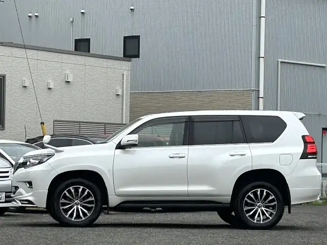 トヨタ ランドクルーザー プラド TX Lパッケージ 宮城県 2020(令2)年 6.5万km ホワイトパールクリスタルシャイン 装備/ベージュ内装/サンルーフ/ＴＲＤ前後エアロ/純正ナビ/(AM、FM、CD、DVD、フルセグTV、SD、BT、USB)/純正エンジンスターター×１/スペアキー×１/ＴＶキャンセラー/３列シート/ウッドステアリング/プッシュスタートボタン/ドアバイザー/機能/寒冷地仕様/レーダークルーズコントロール/レーンキープアシスト/シートヒーターD、N/シートクーラーD、N/パワーシートD、N/横滑り防止/2ndSTARTボタン/四駆切り替えボタン/オフロード切り替えボタン/リアフォグインジケーター/オートライト/アイドルアップ