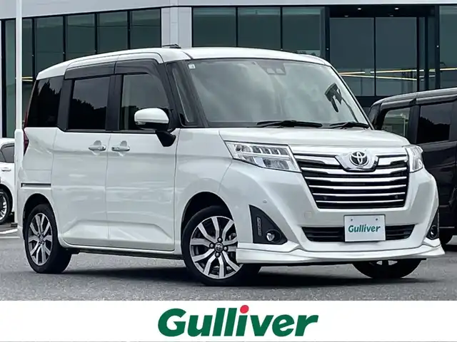 トヨタ ルーミー カスタムG－T 島根県 2020(令2)年 7.7万km パールホワイトⅢ 登録時走行距離　76104km/純正９インチナビ/(AM/FM/CD/Bluetooth)/フルセグテレビ/両側パワースライドドア/オートマチックハイビーム/クルーズコントロール/コーナーセンサー/ビルドインETC/ステアリングスイッチ/アイドリングストップ/衝突軽減ブレーキ/横滑り防止