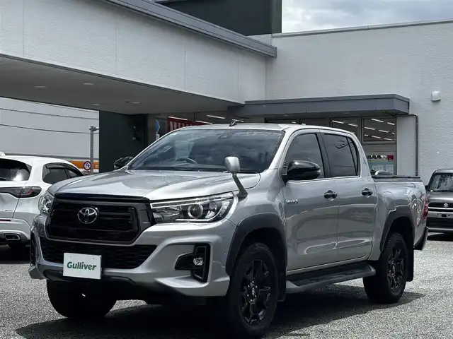 トヨタ ハイラックス Z ブラックラリーエディション 熊本県 2020(令2)年 7.7万km シルバーメタリック ワンオーナー/ハードトノカバー/社外SDナビ（CN-RE06WD）/【フルセグTV/CD/DVD/SD/BT】/バックカメラ/トヨタセーフティセンス/・プリクラッシュセーフティ/・レーンディパーチャアラート/・ロードサインアシスト/・先行車発進告知/レーダークルーズコントロール/ミラー一体型前後ドライブレコーダー/革調シートカバー/ステアリングリモコン/ダウンヒルアシスト/リアデフロック/オートライト/LEDヘッドライト/純正18インチAW/スマートキー/スペアキー/保証書/取扱説明書(車両/ナビ)