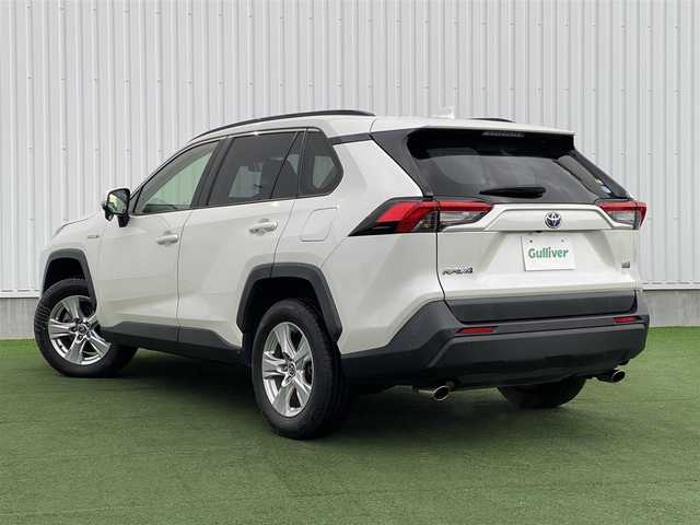 トヨタ ＲＡＶ４ ハイブリットX 香川県 2020(令2)年 6.7万km ホワイトパールクリスタルシャイン 登録時走行距離：66979km/アルパイン9型ナビ/バックカメラ/TRDフロントエアロ/プリクラッシュセーフティシステム/レーンキープアシスト/レーダークルーズコントロール/クリアランスソナー/オートハイビーム/LEDヘッドライト/オートライト/フォグランプ/MTモード付AT/オートホールド機能付き電子パーキングブレーキ/純正フロアマット/電動格納ウィンカーミラー/ラゲッジマット/プッシュスタート/スマートキー