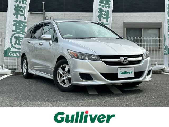 ホンダ ストリーム ZS HDDナビパッケージ 三重県 2009(平21)年 5.9万km スーパープラチナメタリック 登録時58935km/純正ナビ/ＦＭ／ＡＭ／ＨＤＤ／ＤＶＤ／ワンセグＴＶ/バックカメラ/ＥＴＣ/禁煙車/ハンズフリー/電格ミラー/３列シート/シートアレンジ/盗難防止装置/ドアバイザー/スペアキー１本