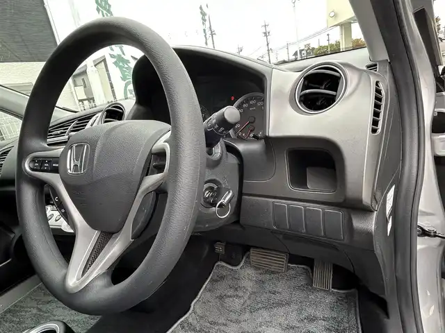 ホンダ ストリーム ZS HDDナビパッケージ 三重県 2009(平21)年 5.9万km スーパープラチナメタリック 登録時58935km/純正ナビ/ＦＭ／ＡＭ／ＨＤＤ／ＤＶＤ／ワンセグＴＶ/バックカメラ/ＥＴＣ/禁煙車/ハンズフリー/電格ミラー/３列シート/シートアレンジ/盗難防止装置/ドアバイザー/スペアキー１本