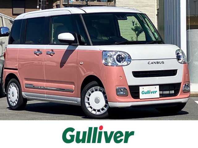 ダイハツ ムーヴ キャンバス ストライプス G 静岡県 2024(令6)年 0.1千km シャイニングホワイトパール/アプリコットピンクメタリック 純正ナビ(CD/DVD/BT/フルセグ)/バックカメラ/登録済未使用車/エンジンスタートボタン/保証書/取扱説明書/パワーステアリング/パワーウィンドウ/アイドリングストップ/オートエアコン/スペアキー１本/USB入力端子/D席N席シートヒーター/両側パワースライドドア/ABS/横滑り防止装置/コーナーセンサー前後/レーンキープアシスト/盗難防止装置/オートライト/オートマチックハイビーム/LEDヘッドライト/W+サイドエアバック/カーテンエアバック/衝突軽減システム/カップヒーター