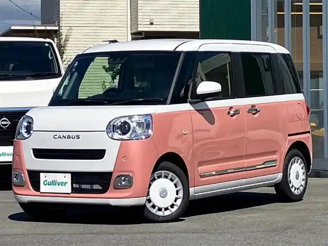 ダイハツ ムーヴ キャンバス ストライプス G 静岡県 2024(令6)年 0.1千km シャイニングホワイトパール/アプリコットピンクメタリック 純正ナビ(CD/DVD/BT/フルセグ)/バックカメラ/登録済未使用車/エンジンスタートボタン/保証書/取扱説明書/パワーステアリング/パワーウィンドウ/アイドリングストップ/オートエアコン/スペアキー１本/USB入力端子/D席N席シートヒーター/両側パワースライドドア/ABS/横滑り防止装置/コーナーセンサー前後/レーンキープアシスト/盗難防止装置/オートライト/オートマチックハイビーム/LEDヘッドライト/W+サイドエアバック/カーテンエアバック/衝突軽減システム/カップヒーター