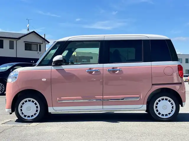 ダイハツ ムーヴ キャンバス ストライプス G 静岡県 2024(令6)年 0.1千km シャイニングホワイトパール/アプリコットピンクメタリック 純正ナビ(CD/DVD/BT/フルセグ)/バックカメラ/登録済未使用車/エンジンスタートボタン/保証書/取扱説明書/パワーステアリング/パワーウィンドウ/アイドリングストップ/オートエアコン/スペアキー１本/USB入力端子/D席N席シートヒーター/両側パワースライドドア/ABS/横滑り防止装置/コーナーセンサー前後/レーンキープアシスト/盗難防止装置/オートライト/オートマチックハイビーム/LEDヘッドライト/W+サイドエアバック/カーテンエアバック/衝突軽減システム/カップヒーター