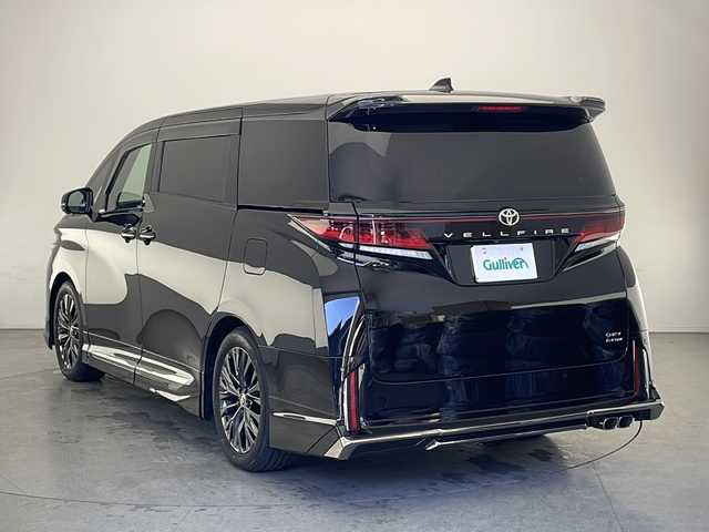 トヨタ ヴェルファイア ハイブリット Z プレミア 長野県 2024(令6)年 1.4万km ブラック 純正ディスプレイオーディオ　/純正フリップダウンモニター　/ビルトインＥＴＣ２．０　/パノラミックビューモニター　/モデリスタエアロ（Ｆ／Ｓ／Ｒ）　/独立ガラスルーフ　/前席＋２列目シートエアコン　　/２列目オットマン/前席パワーシート/レーダークルーズコントロール/デジタルインナーミラー/ブラインドスポットモニター/パーキングサポートブレーキ/リアカメラディテクション/プロアクティブドライビングアシスト/リヤトラフィックアラート /ロードサインアシスト/置くだけ充電