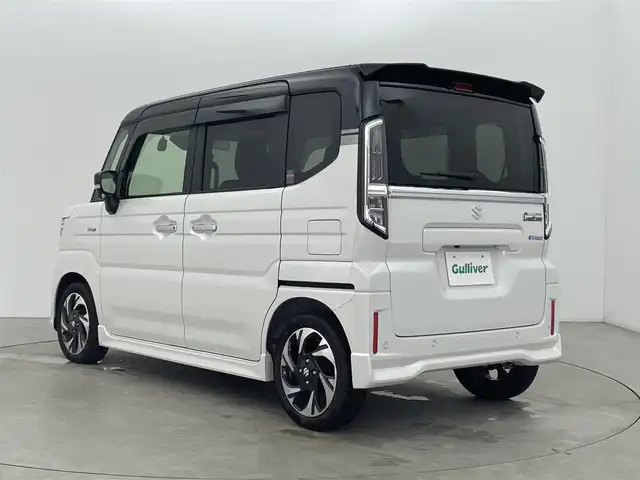 スズキ スペーシア カスタム HYBRID XS 富山県 2025(令7)年 0.8万km ピュアホワイトパール/ブラック2トーン 純正ナビ（AM/FM/BT/USB/フルセグ）/全方位カメラ/ドライブレコーダー/ETC/両側パワースライドドア/ハーフレザーシート/シートヒーター/ハンドルヒーター/衝突被害軽減システム/レーダークルーズコントロール/レーンキープアシスト/コーナーセンサー/横滑り防止装置/ヘッドアップディスプレイ/オートホールド付電子パーキング/純正アルミホイール/純正フロアマット/ハンドルヒーター/革巻きステアリング/ステアリングスイッチ/オートLEDライト/フォグライト/スマートキー