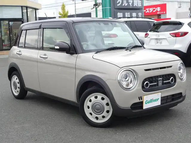 スズキ ラパン ＬＣ X 静岡県 2022(令4)年 1.7万km フォーンベージュメタリック/アーバンブラウン 2トーン ワンオーナー／禁煙車/走行距離17千キロ/フォーンベージュメタリック／アーバンブラウン　2トーン/スズキセーフティサポート/　・デュアルカメラブレーキサポート/　・誤発進抑制機能/　・車線逸脱抑制機能/　・ふらつき警報/　・先行車発進のお知らせ/　・ハイビームアシスト/　・標識認識機能/　・後退時ブレーキサポート/　・後方誤発進抑制機能/　・リアパーキングセンサー/メーカー純正ディスプレイオーディオ/　AM.FM/BT/USB/ミラキャスト/バックカメラ/ビルトインETC/革巻きステアリング/ステアリングリモコン/純正前後ドライブレコーダー/ハーフレザーシート/前席シートヒーター/プッシュスタート／スマートキー/純正ドアバイザー／フロアマット/取扱説明書／保証書