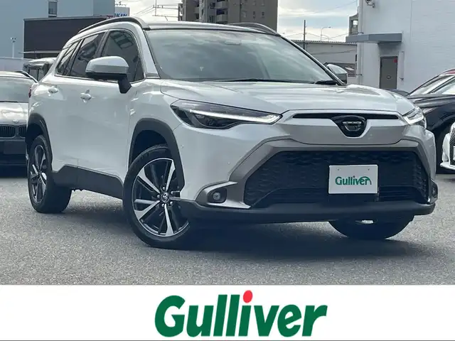 トヨタ カローラ クロス ハイブリッド Z 福岡県 2024(令6)年 0.1万km プラチナホワイトパールマイカ ワンオーナー/純正メーカーナビ/（Bluetooth対応/フルセグTV/AM/FM）/サンルーフ/レーダークルーズコントロール/ブラインドスポットモニター/360度カメラ/バックカメラ/前席シートヒーター/置くだけ充電/パワーバックドア/ルーフレール/ビルトインETC/純正フロアマット/純正アルミホイール/プッシュスタート/ハーフレザー/保証書/取扱説明書/スペアキー/スマートキー