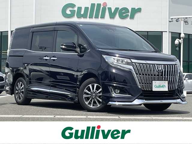 トヨタ エスクァイア Gi 佐賀県 2017(平29)年 6.8万km スパークリングブラックパールクリスタルシャイン モデリスタエアロ/純正9型SDナビ/（CD/DVD/Bluetooth/フルセグTV/USBポート）　/バックカメラ/フリップダウンモニター /両側パワースライドドア/クリアランスソナー/シートヒーター/トヨタセーフティーセンス/クルーズコントロール/ETC/純正フロアマット/純正15インチアルミホイール/純正LEDヘッドライト