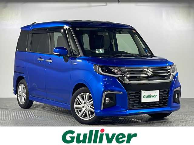 スズキ ソリオ HV MZ 沖縄県 2021(令3)年 2.9万km スピーディーブルーM 禁煙車　/ワンオーナー　/純正９インチナビ　TVキャンセラー付き/（フルセグＴＶ　ＣＤ　ＤＶＤ　Ｂｌｕｅｔｏｏｔｈ）/全方位カメラ　/ＨＵＤ（ヘッドアップディスプレイ）/デュアルブレーキサポート　/コーナーセンサー/両側パワースライドドア　/全方位ドライブレコーダー　/ビルトインＥＴＣ/クルーズコントロール/ステアリングスイッチ/革調シートカバー/投影ドアカーテシランプ