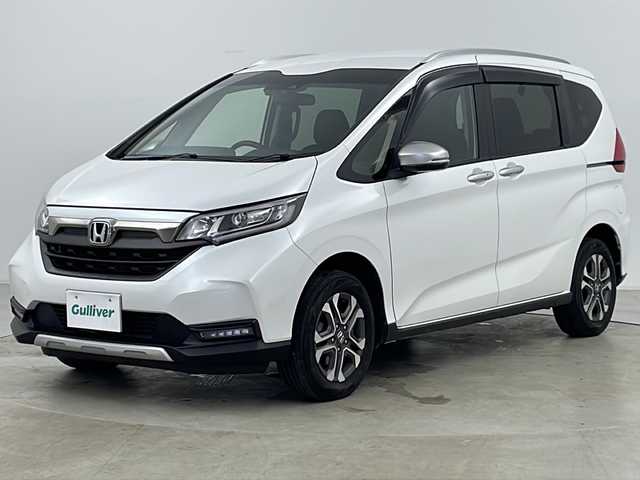 ホンダ フリード クロスター ホンダセンシング 道央・札幌 2020(令2)年 5.8万km プラチナホワイトパール ・ワンオーナー/・寒冷地仕様/・純正ナビ&CD&DVD&BT/・バックカメラ/・ホンダセンシング/・衝突被害軽減ブレーキ/・誤発進抑制機能/・後方誤発進抑制機能/・歩行者事故低減ステアリング/・路外逸脱抑制機能/・クルーズコントロール/・車線維持支援システム/・トラフィックジャムアシスト/・先行車発進お知らせ機能/・標識認識機能/・パーキングセンサーシステム/・横滑り防止装置/・アイドリングストップ/・ECONボタン/・純正前後ドライブレコーダー/・ビルトインETC/・前席シートヒーター/・ハーフレザーシート/・ルーフレール/・革巻きステアリング/・プッシュスタート/・純正フロアマット/・LEDヘッドライト/・フォグランプ/・オートライト/・スマートキー/・スペアキー/・社外AWスタッドレスタイヤ/・保証書/・取扱説明書