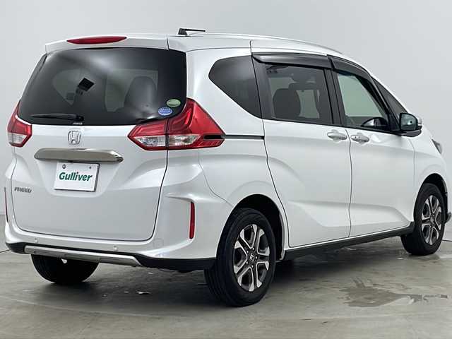 ホンダ フリード クロスター ホンダセンシング 道央・札幌 2020(令2)年 5.8万km プラチナホワイトパール ・ワンオーナー/・寒冷地仕様/・純正ナビ&CD&DVD&BT/・バックカメラ/・ホンダセンシング/・衝突被害軽減ブレーキ/・誤発進抑制機能/・後方誤発進抑制機能/・歩行者事故低減ステアリング/・路外逸脱抑制機能/・クルーズコントロール/・車線維持支援システム/・トラフィックジャムアシスト/・先行車発進お知らせ機能/・標識認識機能/・パーキングセンサーシステム/・横滑り防止装置/・アイドリングストップ/・ECONボタン/・純正前後ドライブレコーダー/・ビルトインETC/・前席シートヒーター/・ハーフレザーシート/・ルーフレール/・革巻きステアリング/・プッシュスタート/・純正フロアマット/・LEDヘッドライト/・フォグランプ/・オートライト/・スマートキー/・スペアキー/・社外AWスタッドレスタイヤ/・保証書/・取扱説明書