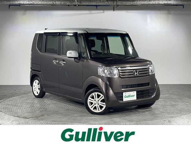 ホンダ Ｎ ＢＯＸ G Lパッケージ 沖縄県 2014(平26)年 5.6万km プレミアムブロンズパール 禁煙車　/純正７インチナビ/【ＣＤ／ＤＶＤ／ＡＭ／ＦＭ／ＢＴ／ワンセグＴＶ】　/片側パワースライドドア　/電動格納ミラー　/横滑り防止装置　/盗難防止装置　/１４インチ純正アルミ/純正フロアマット　/スマートキー