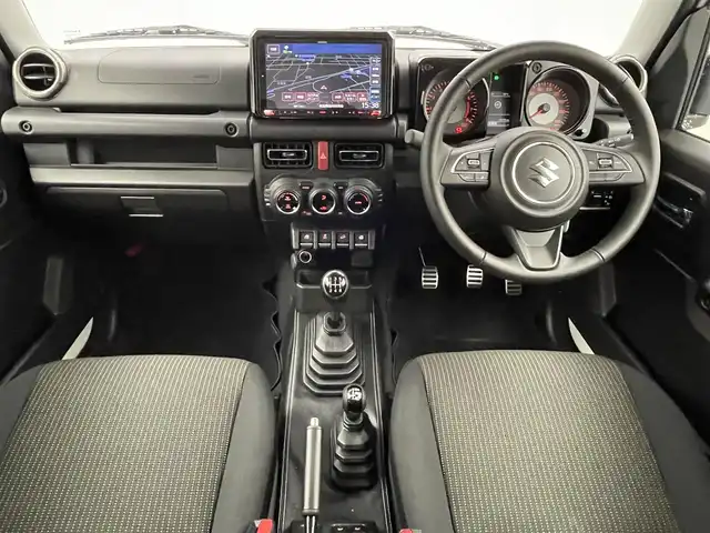 スズキ ジムニー シエラ JC 埼玉県 2023(令5)年 0.7万km ピュアホワイトP 社外９型ナビ　/ＭＴ車　/４ＷＤ　/スズキセーフティーサポート　/衝突軽減　/車線抑制　/ステアリングスイッチ　/ドライブレコーダー　/ＥＴＣ　/ＬＥＤヘッドライト　/フォグライト　/オートライト　/純正ＡＷ　