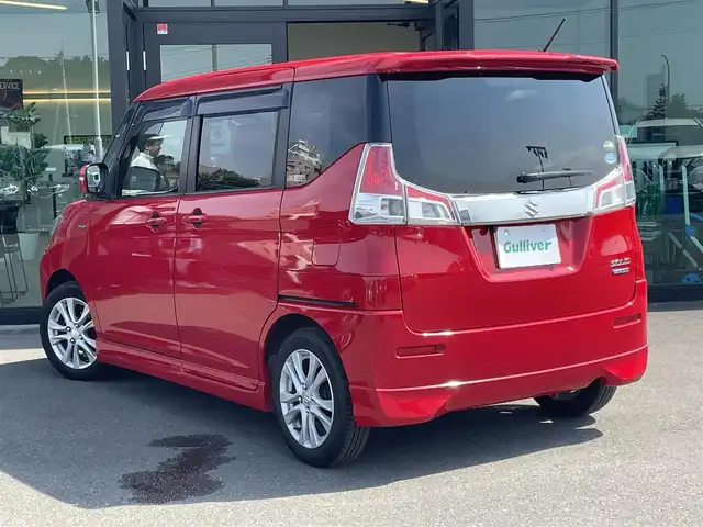 スズキ ソリオ HV MZ Dカメラ ブレーキS 東京都 2016(平28)年 7.5万km ファーベントレッド 純正7インチナビ/フルセグTV/Bluetooth/CD/DVD/両側パワースライドドア/バックカメラ/デュアルカメラブレーキサポート/・前方衝突軽減システム/・誤発進抑制/・車線逸脱警報/・ふらつき警報/・先行車発進お知らせ/・エマージェンシーストップシグナル/・クルーズコントロール/後席ロールサンシェード/運転席シートヒーター/オートライト/ETC/ドライブレコーダー(HDR-102)/フロントフォグランプ/革巻きステアリングホイール/ステアリングスイッチ/オートエアコン/純正15インチアルミホイール/ダブル＋サイドエアバッグ/アイドリングストップ/保証書/取扱説明書/プッシュスタート