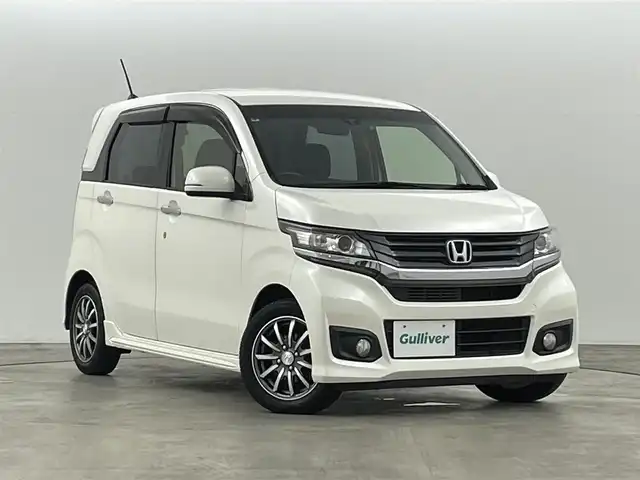 ホンダ Ｎ ＷＧＮ カスタム G ターボパッケージ 福島県 2015(平27)年 7.5万km プレミアムホワイトパール 純正ナビゲーション/・型番：VXM-155VSi/・フルセグTV/BT/CD/DVD/USB/SD/FM/AM/・バックカメラ/・ETC/・前後ドライブレコーダー/革張ステアリング/・ステアリングリモコン/・パドルシフト/・クルーズコントロール/衝突被害軽減ブレーキ/ハーフレザーシート/アイドリングストップ/プッシュスタート/・スマートキー/電動格納ミラー/・ウィンカーミラー/LEDヘッドライト/・フォグライト/・オートライト/純正フロアマット/ドアバイザー/純正14インチAW