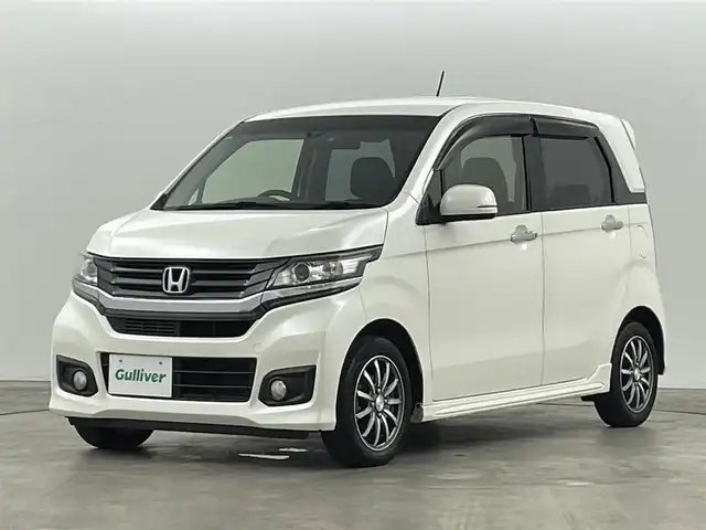 ホンダ Ｎ ＷＧＮ カスタム G ターボパッケージ 福島県 2015(平27)年 7.5万km プレミアムホワイトパール 純正ナビゲーション/・型番：VXM-155VSi/・フルセグTV/BT/CD/DVD/USB/SD/FM/AM/・バックカメラ/・ETC/・前後ドライブレコーダー/革張ステアリング/・ステアリングリモコン/・パドルシフト/・クルーズコントロール/衝突被害軽減ブレーキ/ハーフレザーシート/アイドリングストップ/プッシュスタート/・スマートキー/電動格納ミラー/・ウィンカーミラー/LEDヘッドライト/・フォグライト/・オートライト/純正フロアマット/ドアバイザー/純正14インチAW
