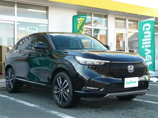 ホンダ ヴェゼル ハイブリッド e:HEV Z 静岡県 2024(令6)年 1.7万km クリスタルブラックパール ワンオーナー/禁煙車/ホンダセンシング/・衝突軽減ブレーキ/・後方誤発進抑制機能/・歩行者事故軽減ステアリング/・車線維持支援システム/・標識認識機能/・アダクティブクルーズコントロール/・オートハイビーム/・アクティブコーナリングライト/・ブラインドスポットモニター/Gathers9インチナビ/バックカメラ/フルセグテレビ/Bluetooth/DVD再生/Music Rack/ハーフレザーシート/シートヒーター/ステアリングヒーター/パワーバックドア/スマートキー/フロアマット/ETC/新車保証書/取扱説明書