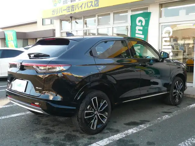 ホンダ ヴェゼル ハイブリッド e:HEV Z 静岡県 2024(令6)年 1.7万km クリスタルブラックパール ワンオーナー/禁煙車/ホンダセンシング/・衝突軽減ブレーキ/・後方誤発進抑制機能/・歩行者事故軽減ステアリング/・車線維持支援システム/・標識認識機能/・アダクティブクルーズコントロール/・オートハイビーム/・アクティブコーナリングライト/・ブラインドスポットモニター/Gathers9インチナビ/バックカメラ/フルセグテレビ/Bluetooth/DVD再生/Music Rack/ハーフレザーシート/シートヒーター/ステアリングヒーター/パワーバックドア/スマートキー/フロアマット/ETC/新車保証書/取扱説明書