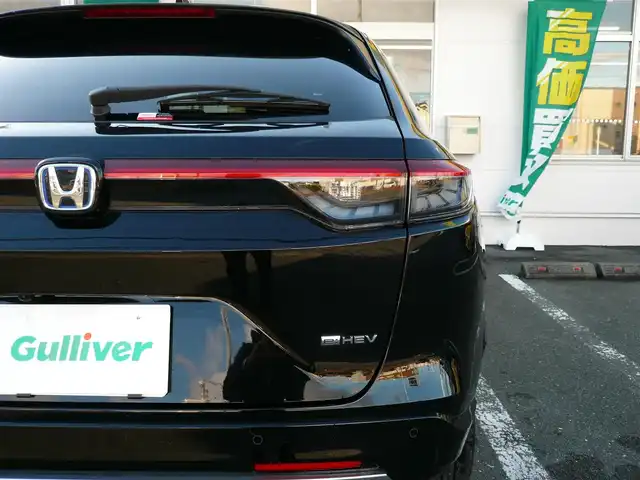 ホンダ ヴェゼル ハイブリッド e:HEV Z 静岡県 2024(令6)年 1.7万km クリスタルブラックパール ワンオーナー/禁煙車/ホンダセンシング/・衝突軽減ブレーキ/・後方誤発進抑制機能/・歩行者事故軽減ステアリング/・車線維持支援システム/・標識認識機能/・アダクティブクルーズコントロール/・オートハイビーム/・アクティブコーナリングライト/・ブラインドスポットモニター/Gathers9インチナビ/バックカメラ/フルセグテレビ/Bluetooth/DVD再生/Music Rack/ハーフレザーシート/シートヒーター/ステアリングヒーター/パワーバックドア/スマートキー/フロアマット/ETC/新車保証書/取扱説明書