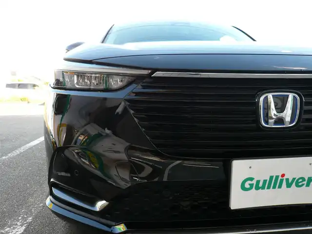 ホンダ ヴェゼル ハイブリッド e:HEV Z 静岡県 2024(令6)年 1.7万km クリスタルブラックパール ワンオーナー/禁煙車/ホンダセンシング/・衝突軽減ブレーキ/・後方誤発進抑制機能/・歩行者事故軽減ステアリング/・車線維持支援システム/・標識認識機能/・アダクティブクルーズコントロール/・オートハイビーム/・アクティブコーナリングライト/・ブラインドスポットモニター/Gathers9インチナビ/バックカメラ/フルセグテレビ/Bluetooth/DVD再生/Music Rack/ハーフレザーシート/シートヒーター/ステアリングヒーター/パワーバックドア/スマートキー/フロアマット/ETC/新車保証書/取扱説明書