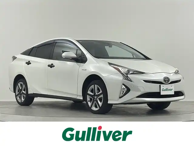 トヨタ プリウス A ツーリングセレクション 山形県 2016(平28)年 10.1万km ホワイトパールクリスタルシャイン 純正９型ナビ　フルセグ　ＢＴ　ＤＶＤ　前席シートヒーター　バックカメラ　ドライブレコーダー　前後コーナーセンサー　ＢＳＭ　ヘッドアップディスプレイ　レーダー探知機　純正フロアマット　リフトアップ